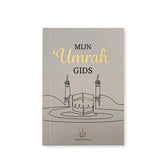 Boekcover van Mijn Umrah Gids met minimalistische tekening van Kaaba en gouden tekst